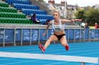 Emily Stewart on her way to winning the 3000 metres steeplechase at the Scottish Championships, Scotstoun  Stadium, Glasgow.